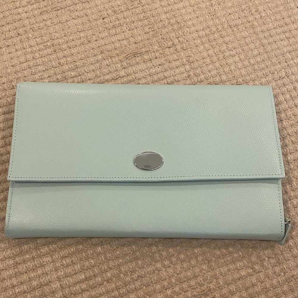 Pottery Barn Travel jewelry case in light greenish teal color.